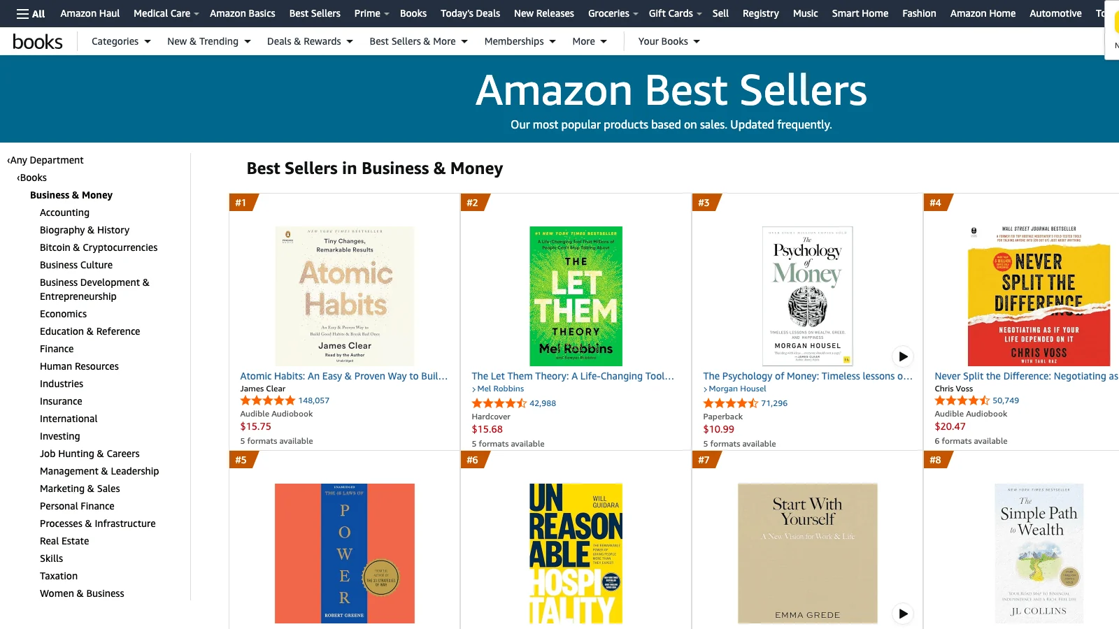 Amazon Best Sellers list in Business and Money showing Atomic Habits, The Let Them Theory, The Psychology of Money, Never Split the Difference and other top sellers with flat-color or single-icon covers